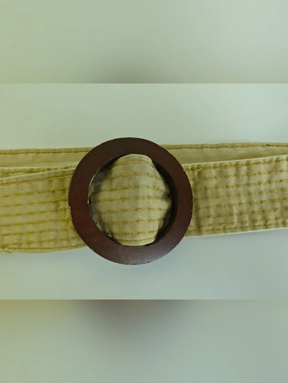 beige canvas stripe boho Y2K belt features dark brown round wooden buckle